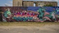 A portion of one of many large murals created during `Trigger Fingers` a 3 Day mural painting event in March 2022 in Deep Ellum.