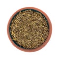 Portion of organic thyme leaf in a small terracotta bowl on a white background top view