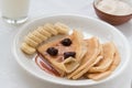 Portion pancakes with srawberry jam and bananas Royalty Free Stock Photo