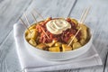 Portion of patatas bravas with sauces