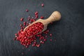 Portion of Pink Peppercorns on a slate slab