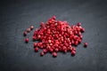 Portion of Pink Peppercorns on a slate slab