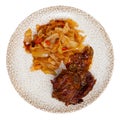 Portion of pork meat with stewed cabbage