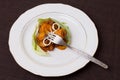 Portion of pork stew with potatoes, cheese and cauliflower leaves. Royalty Free Stock Photo