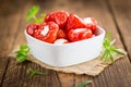 Portion of Red Pepper stuffed with cheese on wooden background