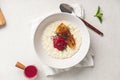 Portion of rice porridge with banana and jam