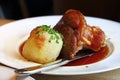 Portion of roasted pork shank with dumplings Royalty Free Stock Photo