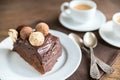 Portion of Sacher torte with two cups of coffee Royalty Free Stock Photo