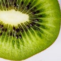 Portion of a slice of kiwi isolated on white background.