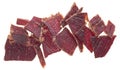 Portion of sliced and dried meat isolated on white background. Top view of beef jerky pieces Royalty Free Stock Photo