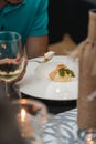 Portion of sorbet with melon balls and mint leaves served on a white platein a restaurant . Closeup Royalty Free Stock Photo