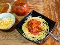 Portion of Spaghetti alla Sorrentina on old table