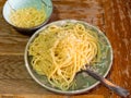 Portion Spaghetti Cacio e Pepe on old wooden table