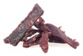 Portion of spiced beef jerky isolated on white background. Dried peppered beef jerky Royalty Free Stock Photo