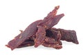 Portion of spiced beef jerky isolated on white white background. Dried peppered beef jerky Royalty Free Stock Photo