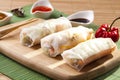 Portion of spring rolls on a bamboo board