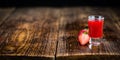 Portion of Strawberry liqueur on wooden background, selective fo Royalty Free Stock Photo