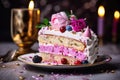 A portion of a tasty, frosted birthday cake with a decorated design and pastel colors