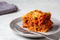 Portion of traditional Italian lasagna with meat and cheese on gray plate. Italian cuisine concept Royalty Free Stock Photo