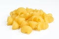 Portion of uncooked pasta snails isolated on white background. Dry Italian rigate dish