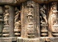 A portion of a wall decorated with various idols curved out of stones of Konark Sun Temple, Odisha, India Royalty Free Stock Photo