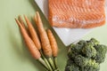 Portions of fresh salmon fillet and vegetables