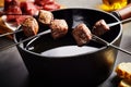 Portions of tender beef cooked in a fondue pot Royalty Free Stock Photo