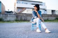 Portirat young asian girl wear Jean ant hat.Old town background