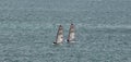 Portland Harbor, UK - July 1, 2020: Two racing boats sailing in the harbor