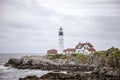 Maine lighthouse Portland Head Light and rocky cliff Royalty Free Stock Photo