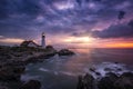 Portland Head Lighthouse under Dark clouds at sunrise Royalty Free Stock Photo