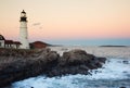 Portland Lighthouse Guides Fishing Vessel at Dusk in Maine