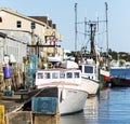 Fishing boats moored at a working dock in Porland Maine with blurred forground Royalty Free Stock Photo