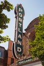 Portland sign between green tree branches