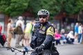 Cop on a bicycle wearing helmet