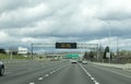 Portland, OR / USA - March 29 2020: Electronic sign on I205 freeway notifying people to stay home and save lives by reducing the Royalty Free Stock Photo