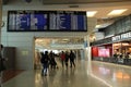 Passengers walking with suitcases through the Porto Airport