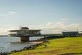 Porto Alegre, Rio Grande do Sul, Brazil, March 29 - 2021: Beautiful sunset on the edge of GuaÃÂ­ba, Gasometro at golden hour Royalty Free Stock Photo