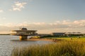 Porto Alegre, Rio Grande do Sul, Brazil, March 29 - 2021: Beautiful sunset on the edge of GuaÃÂ­ba, Gasometro at golden hour Royalty Free Stock Photo