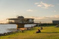 Porto Alegre, Rio Grande do Sul, Brazil, March 29 - 2021: Beautiful sunset on the edge of GuaÃÂ­ba, Gasometro at golden hour Royalty Free Stock Photo