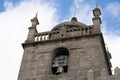 The Porto Cathedral bell tower close up, detail view against a blue sky with clouds in Portugal Royalty Free Stock Photo