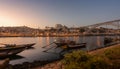 Porto cityscape in sunset with river on the front and wine carrier ship in  foreground and city of Porto in background, Portugal Royalty Free Stock Photo