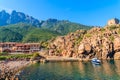 PORTO, CORSICA ISLAND - JUN 27, 2015: boat in Porto harbour in early morning. Porto is a small village to the west of Corsica, Royalty Free Stock Photo