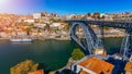 Porto panoramic aerial view of Dom Luis Bridge and houses with red roof tiles in a beautiful summer day. Porto, Portugal