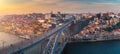 Porto panoramic aerial view of Dom Luis Bridge at sunset. Porto, Portugal. Cityscape of Porto downtown touristic Ribeira Royalty Free Stock Photo