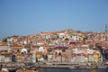 Porto panoramic landmark with boats on sunny day. Old buildings with brick roofs by river Douro in Porto, Portugal. Royalty Free Stock Photo