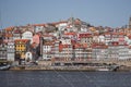 Porto panoramic landmark with boats on sunny day. Old buildings with brick roofs by river Douro in Porto, Portugal. Royalty Free Stock Photo