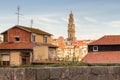 Porto panoramic landmark with church tower on sunny day. Old buildings with red brick roofs in Porto, Portugal.