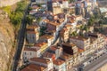 Porto panoramic landmark on sunny day. Old buildings with red brick roofs on the hill in Porto, Portugal.