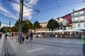 Porto, Portugal. August 12, 2017: Square with cobblestone floor and bar terraces full of people drinking in the center of the city Royalty Free Stock Photo